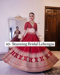 a woman in a red and gold bridal lehenga is posing for the camera