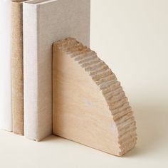 a wooden bookend with an arch made out of plywood