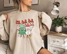 "family christmas christmas sweatshirt funny holiday hoodie christmas crew funny christmas matching tees funny sweatshirt matching sweatshirt christmas gift ideas christmas tree holiday shirt couple sweatshirt snow sweatshirt  All of our products are unisex. Please check the size guide in the images section to avoid disappointment. ❣️💌 📌 Carefully hand-printed using the latest technology printing houses and ink. 📌 Fits like a glove. No really, there's a new men's and women's Tee/Hoodie with a much more modern cut. 📌 Quality soft fabric. Feels like wearing it on a Saturday afternoon! HOW TO ORDER  ❤ Please Check and Review All Photos. ❤ Choose your Tee/Hoodie Style from the menu. ❤ Choose Your Piece As Much As You Want. ❤Click ADD TO CART. You can go back or complete the checkout to add Christmas Mental Health, Groovy Christmas, Snowman Shirt, Funny Christmas Sweaters, Hippie Shirt, Trendy Winter, Holiday Sweatshirt, Winter Sweatshirt, Sweatshirt Christmas