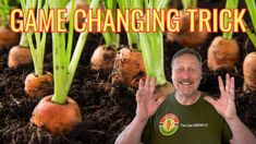 a man standing in front of some carrots with the caption game changing trick