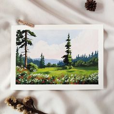 a painting of a field with flowers and trees on it next to a teddy bear