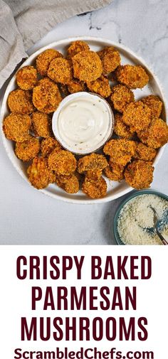 crispy baked parmesan mushrooms served with ranch dip in a white bowl on a marble table