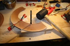 the tools are being used to make a circular object with plywood and other materials