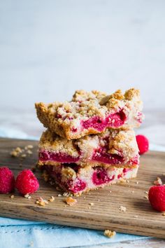 raspberry crumb bars stacked on top of each other