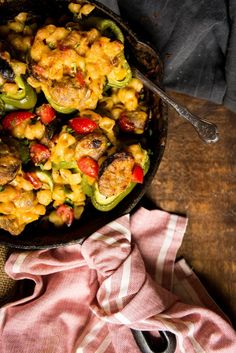 a skillet filled with food on top of a wooden table