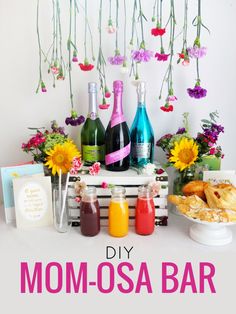 mom - osa bar with flowers hanging from the ceiling and bottles of alcohol on top