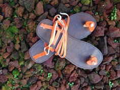 These leather sandals are handcrafted to perfection with an orange heart and ankle straps. Adjustable Ankle Strap Orange Sandals, Adjustable Ankle Strap Sandals In Orange, Orange Sandals With Leather Sole For The Beach, Orange Round Toe Sandals For Festival, Orange Single Toe Strap Sandals For The Beach, Handmade Orange Open Toe Sandals, Adjustable Orange Sandals For Festival, Orange Heart, Ankle Straps