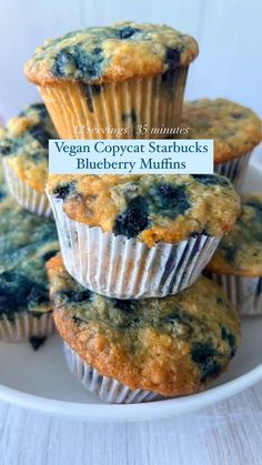 blueberry muffins stacked on top of each other with the title vegan copycat starbucks's blueberry muffins