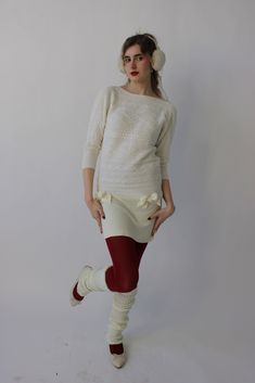 Stretchy and comfy knit material, best fit sizes S-M Super cute paired with red tights and leg warmers Stretch Sweater Dress For Winter Loungewear, Fitted Cozy Sweater Dress For Loungewear, Fitted Cozy Sweater Dress For Winter, Fitted Cream Sweater Dress, Cream Fitted Cozy Sweater Dress, Fitted Cozy Cream Sweater Dress, Cozy Fitted Cream Sweater Dress, Red Knee-high Socks For Fall, Cozy Fitted Knee-length Sweater Dress