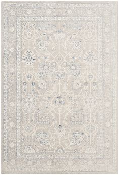 an area rug with white and blue accents on the floor, including a large medallion design