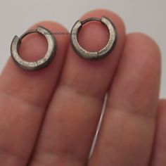 Custom gauged earpost hoop earrings for men. 12G, 14G, 16G, 18G, or 20G hoop earrings. These gauged hoop earrings are 9mm in diameter and are sized M. Sold as a pair or single earring. SPECIFICATION Base metal: Recyclable fine 925 Sterling Silver Outer layer : Black plating, matte finish Outer Diameter: 13mm Inner Diameter: 9mm, size M Width: 2.5mm Ear Post Gauge: 12G, 14G, 16G, 18G, 20G Measurements are an approximation. Available in polished white https://www.etsy.com/listing/250896161 Thank y Internally Threaded Hoop Plug Earrings As Gift, Single Round Metal Cartilage Earring, Hypoallergenic Metal Huggie Cartilage Earrings, Metal Huggie Cartilage Earrings, Metal Huggie Single Earring Piercing, Nickel-free Round Metal Cartilage Earrings, Small Hoop Metal Cartilage Earring, Nickel-free Round Cartilage Earrings, Internally Threaded Metal Hoop Huggie Earrings