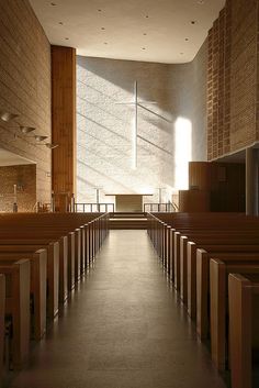 the inside of a church with rows of pews lined up in front of it