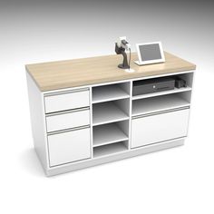 a computer desk with drawers and a tablet on top