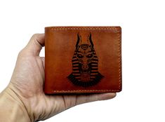 "All products are made from genuine veg-tan leather wallet and made by hand. --- OVERVIEW --- - Size: 11cm x 9.5cm (~ 4.3 inch x 3.7 inch) - High quality cowhide, handmade - Ancient Egypt insect design is engraved in front side of the wallet. The leather handmade men wallet have 10 COLORS, 05 STYLES OF WALLET, NAME/TEXT/IMAGE... ENGRAVING --- CUSTOMIZATION --- - With an extra charge of US$5/each name/initials/image in each side, personalized request will be made as your idea. - For customization Name Wallet For Men, Customizable Leather Wallets For Gifts, Cheap Personalized Brown Wallets, Customizable Brown Wallets For Personalized Gift, Insect Design, Egypt Ancient, The Ankh, Personalized Mens Wallet, Key Of Life