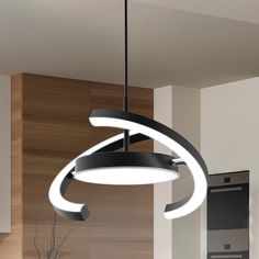 a modern light fixture hanging from the ceiling in a kitchen