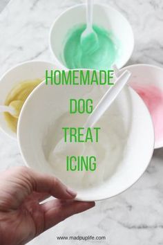 homemade dog treat icing in white bowls with green and yellow icing on them