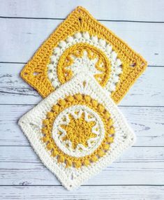 two yellow and white crocheted squares sitting on top of each other