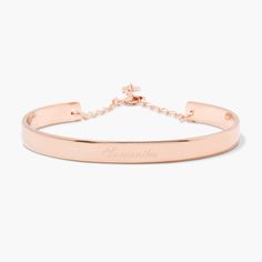 Simple yet sophisticated, the elegance of the Gwen Cuff Bracelet makes it an instant classic. Personalize it with your name or the name of a loved one in your choice of engraving styles. Available in 14k gold plated, rhodium plated or 14k rose gold plated brass Width: 1/4" Length: 5 1/2" With engraving this item is FINAL SALE SKU: BYB1031 Classic Rose Gold Tarnish-resistant Bracelet, Classic Adjustable Rose Gold Bangle, Personalized Name Bracelet In Rose Gold, Customizable Rose Gold Bracelet For Personalized Gifts, Personalized Rose Gold Nameplate Bracelets, Adjustable Polished Rose Gold Bangle, Adjustable Rose Gold Bangle With Polished Finish, Classic Adjustable Rose Gold Cuff Bracelet, Adjustable Rose Gold Classic Bracelets