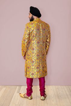 Elevate your style with our AAYAN Yellow Sherwani, perfect for a haldi ceremony or mehendi night. Inspired by traditional Indian groom attire, this exclusive design is the epitome of elegance for your special day. With a golden yellow base, a vibrant mehendi inspired pattern fills this sherwani for a truly eye-catching outfit. Make a statement at your next Indian wedding with this luxurious piece. ESTIMATED DELIVERY : This product is made to order. Please allow 4 - 12 weeks for your product to b Indian Groom Attire, Mehendi Night, Indian Groom, Haldi Ceremony, Groom Attire, 12 Weeks, Traditional Indian, Golden Yellow, Exclusive Designs