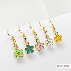 Bloom into style with this adorable set of daisy earrings in soft pastel shades! Featuring three charming colors, each daisy earring brings a fresh, cheerful vibe to any outfit. These cute floral earrings are lightweight, making them perfect for daily wear, and they add a playful, nature-inspired touch to your accessory collection. Whether you're gifting these earrings to a teen, a nature lover, or someone who loves fun, whimsical accessories, this set is sure to bring a smile. Available with hook, stud, or clip-on closures for the perfect fit. 🌸✨ Specification ✨🌸 * 18k Gold Plated Earrings * Enamel Charms ✨ Add a Personal Touch with Our Greeting Cards! ✨ Make your gift extra special by including one of our charming greeting cards. Choose from our delightful selection of birthday, Christ Whimsical Accessories, Daisy Earrings, Pastel Shades, Enamel Charms, Pretty Pastel, Stunning Earrings, A Teen, Floral Earrings, Nature Lovers