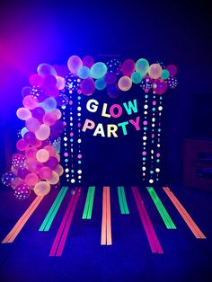 glow party entrance with balloons and streamers