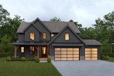 a large gray house with two garages in the front