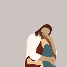 two people hugging each other in front of a gray background with one person holding the other