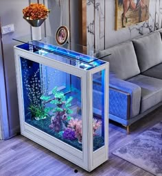 a living room filled with furniture and a fish tank