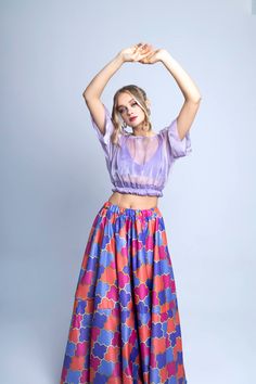 Enjoy summer to the fullest in our Swann organza crop top and printed skirt set! Two Piece top and skirt set Sheer crop Organza Top with elastic band Full length skirt Elastic waist band Color Lilac - Multi Dry Clean Model is wearing a Small.