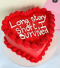 a red heart shaped cake with the words long stay shot survived written on it's side