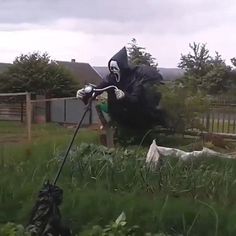 a man is flying through the air on top of a pole