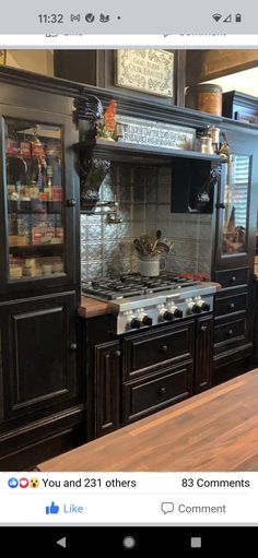 a kitchen with black cabinets and an oven on the counter top is seen in this instagramtion