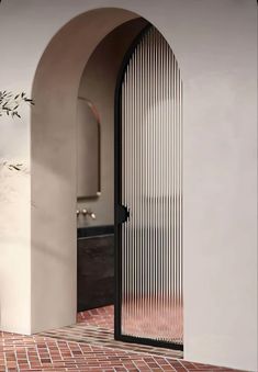 Modern Arch Aluminum Glass Design Door Kamp Studios Plaster, Tub Room, Aluminium Glass Door, Arched Doors, Spanish Revival, Indoor Wall Lights, غرفة ملابس, Pocket Doors, Diffused Light