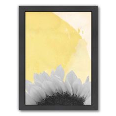 a black and white photo with a sunflower in the foreground against a yellow background