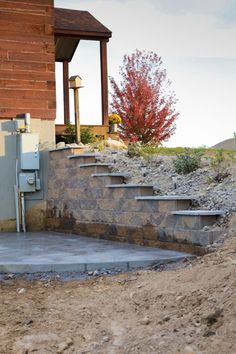 a stone wall with steps leading up to it