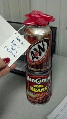 a can with a red bow on top of it and a note attached to it