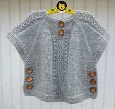 a knitted sweater with buttons on the front and back, hanging from a hanger