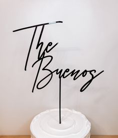 there is a cake with the word the brevos on it in cursive writing