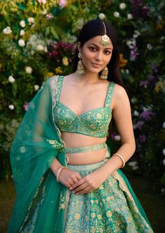 Capture the essence of elegance in this vivid green zari dori embroidered lehenga, meticulously crafted to perfection. Adorned with intricate embroidery, this ensemble exudes sophistication and charm. Paired elegantly with a net dupatta, it's the ideal choice for making a statement at any special occasion.