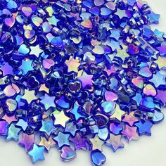 purple and blue stars are scattered on a white surface