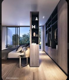 a bedroom with wooden flooring and built in closets next to a window that looks out onto the outdoors