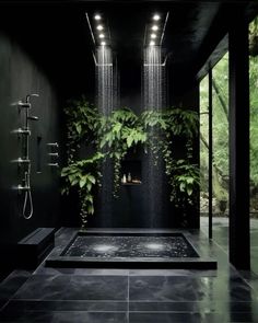 a black bathroom with plants growing on the wall and shower head in the middle,