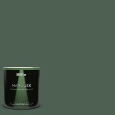 a can of marquee paint on a green background