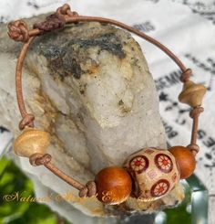 This bracelet features repurposed, vintage wooden beads on leather cord and is adjustable up to 10". Repurposed Vintage, Handmade Bracelet, Wooden Beads, Leather Cord, Handmade Bracelets, Jewelry Bracelets, Accessory Gift, Beaded Bracelets, Electronic Accessories