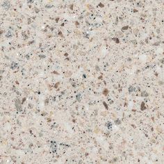 a close up view of the top of a countertop with white and brown speckles