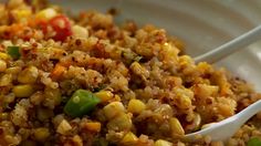 a white bowl filled with rice and vegetables