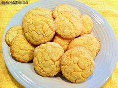 a white plate topped with cookies on top of a yellow table cloth