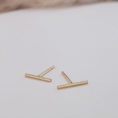 Everyday wear bar earrings for women. Available in 14k yellow gold filled and sterling silver -14K gold-filled, won't tarnish, completely waterproof -approx. 10mm Classic 14k Gold Filled Cartilage Earrings As Gift, Simple Single 14k Gold Earring, Simple Gold Cartilage Earrings For Everyday, Minimalist 14k Gold-filled Cartilage Earrings, Simple Yellow Gold Sterling Silver Earrings, Gold Rectangular Linear Earrings For Everyday, Everyday Gold Tarnish Resistant Linear Earrings, Rectangular Yellow Gold Earrings For Everyday, Yellow Gold Rectangular Earrings For Everyday