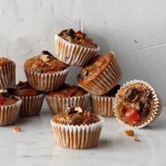 a bunch of muffins sitting on top of a counter