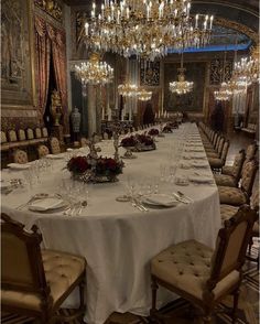 a large dining room set up for a formal dinner